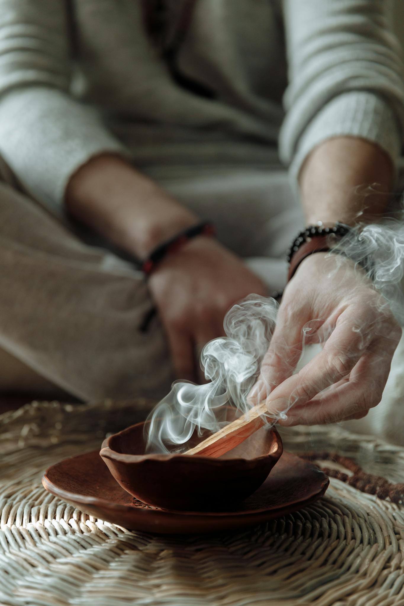 A tranquil moment of spiritual healing with Palo Santo smudging indoors.